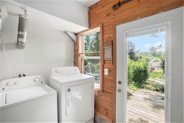 8828 Elm, Fremont, MI 49412 - laundry room with separate washer and dryer and wood walls
