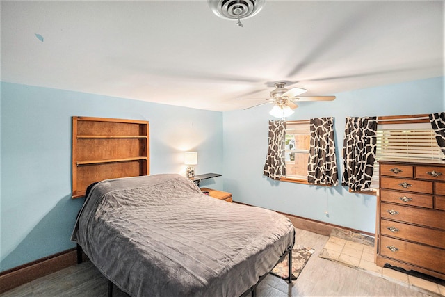 8828 Elm, Fremont, MI 49412 - bedroom with light wood-type flooring and ceiling fan