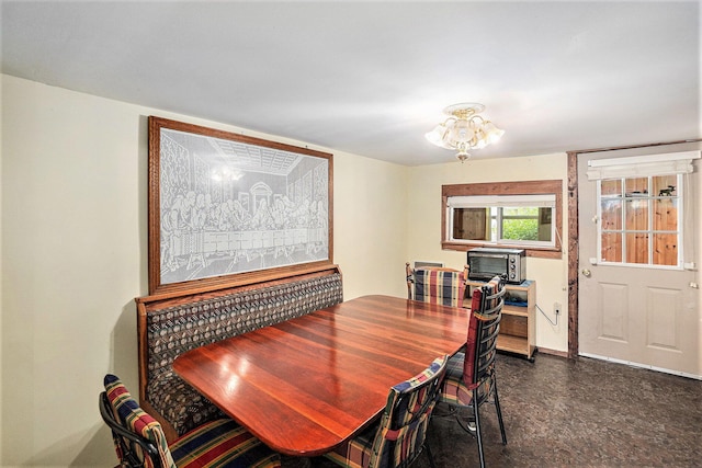8828 Elm, Fremont, MI 49412 - dining area featuring a chandelier and baseboards