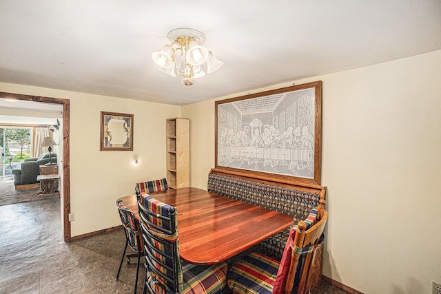 8828 Elm, Fremont, MI 49412 - dining area with a chandelier and baseboards