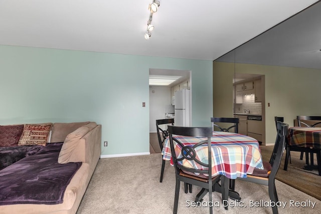 2623 Ridgecroft Dr SE Unit 301, Grand Rapids, MI 49546 - dining space featuring light colored carpet and rail lighting