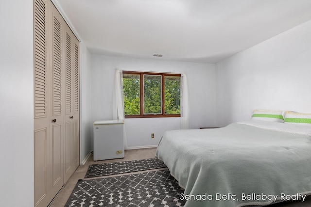 2623 Ridgecroft Dr SE Unit 301, Grand Rapids, MI 49546 - carpeted bedroom featuring fridge and a closet