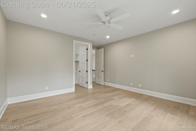 32575 Romsey Rd, Franklin, MI 48025 - unfurnished bedroom featuring light wood finished floors, recessed lighting, a spacious closet, and ceiling fan