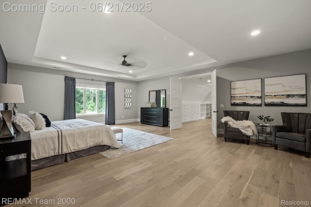32575 Romsey Rd, Franklin, MI 48025 - bedroom with a tray ceiling, light wood finished floors, and recessed lighting