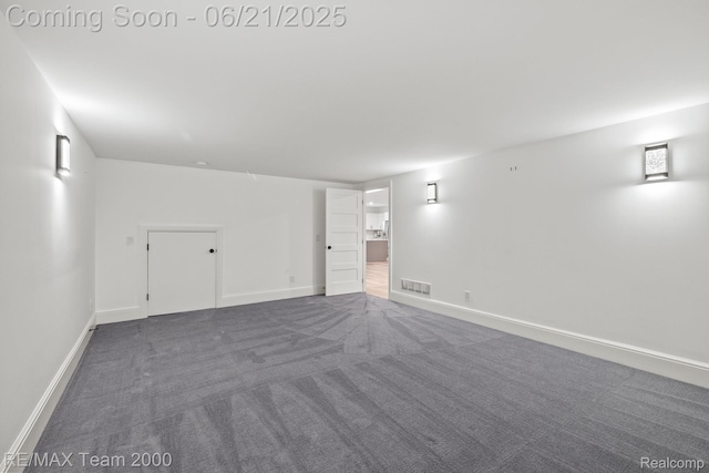 32575 Romsey Rd, Franklin, MI 48025 - unfurnished room with dark carpet and baseboards