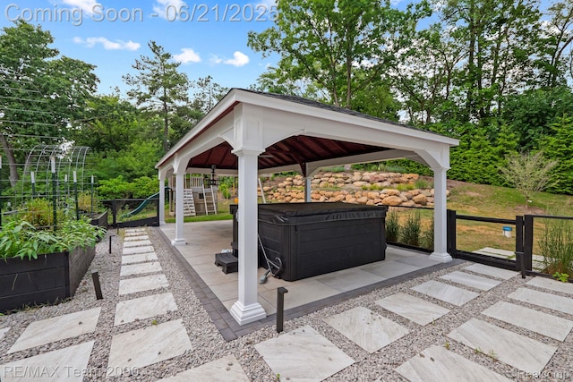 32575 Romsey Rd, Franklin, MI 48025 - view of patio / terrace with a hot tub and a gazebo
