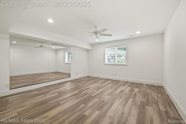 32575 Romsey Rd, Franklin, MI 48025 - unfurnished bedroom featuring multiple windows, recessed lighting, light wood-style floors, a closet, and ceiling fan