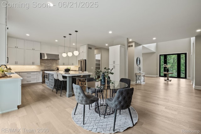 32575 Romsey Rd, Franklin, MI 48025 - dining room featuring light wood-style floors and recessed lighting