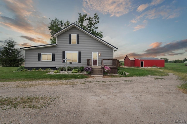 14211 Gilbert Rd, Waldron, MI 49288 - view of front of home featuring a front lawn and an outdoor structure