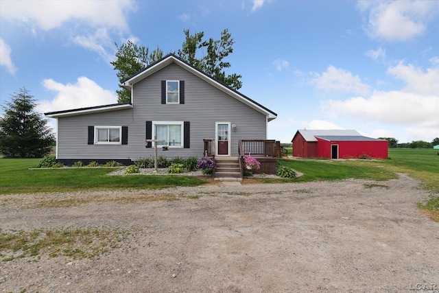 14211 Gilbert Rd, Waldron, MI 49288 - view of front of home featuring a front yard, driveway, and an outdoor structure