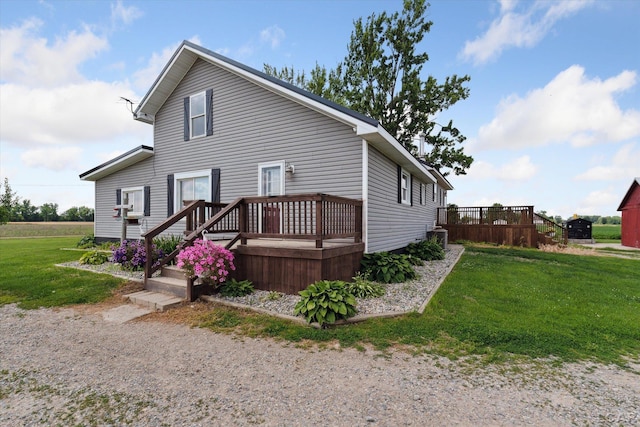 14211 Gilbert Rd, Waldron, MI 49288 - view of side of home with a deck and a lawn