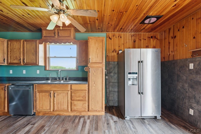 14211 Gilbert Rd, Waldron, MI 49288 - kitchen with appliances with stainless steel finishes, wooden ceiling, dark countertops, a ceiling fan, and brown cabinetry