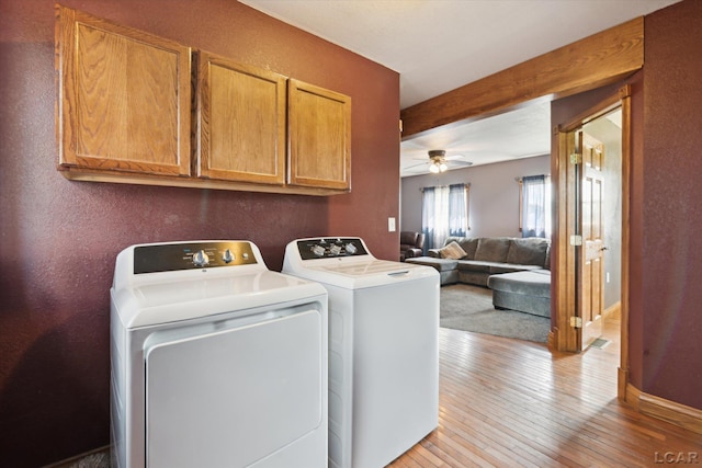 14211 Gilbert Rd, Waldron, MI 49288 - washroom with independent washer and dryer, light wood-type flooring, ceiling fan, cabinet space, and a textured wall