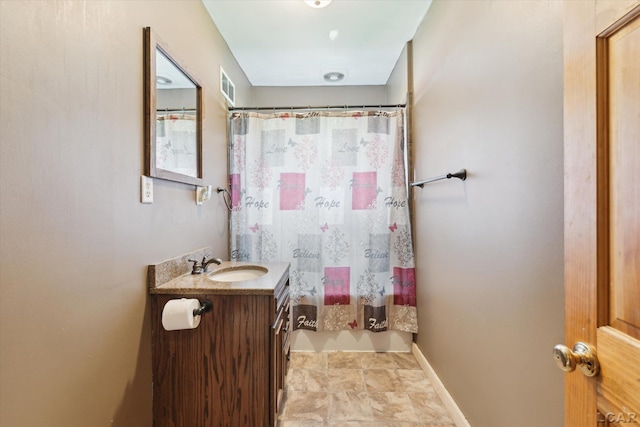 14211 Gilbert Rd, Waldron, MI 49288 - bathroom with vanity, stone finish floors, and shower / bath combo