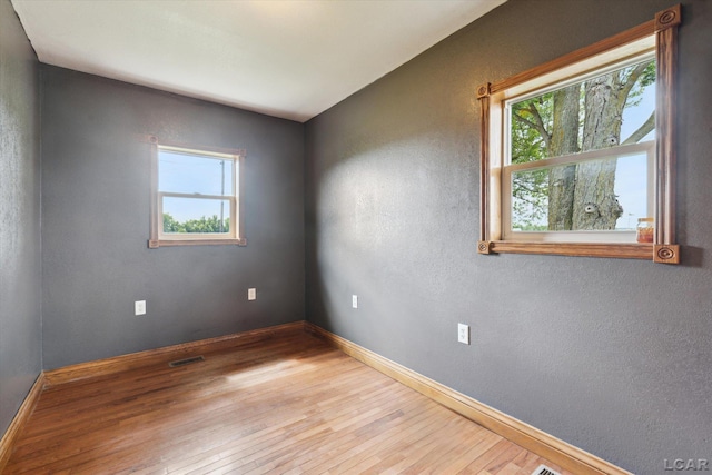 14211 Gilbert Rd, Waldron, MI 49288 - empty room featuring hardwood / wood-style flooring