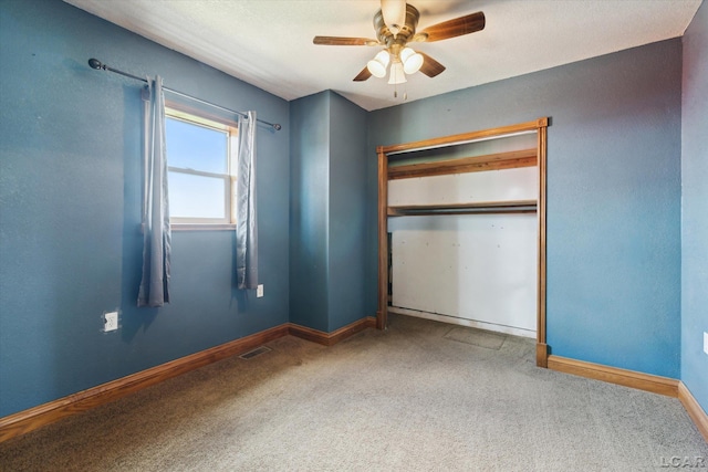 14211 Gilbert Rd, Waldron, MI 49288 - unfurnished bedroom with carpet flooring, a ceiling fan, and a closet
