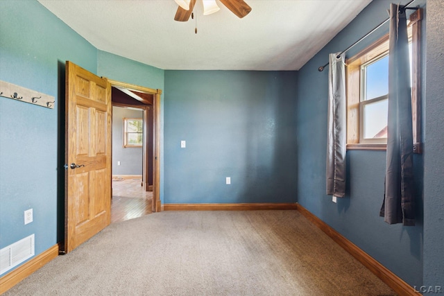 14211 Gilbert Rd, Waldron, MI 49288 - spare room with ceiling fan, plenty of natural light, and carpet flooring