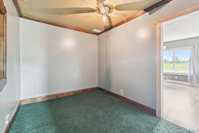 14211 Gilbert Rd, Waldron, MI 49288 - spare room featuring dark colored carpet, a ceiling fan, and crown molding