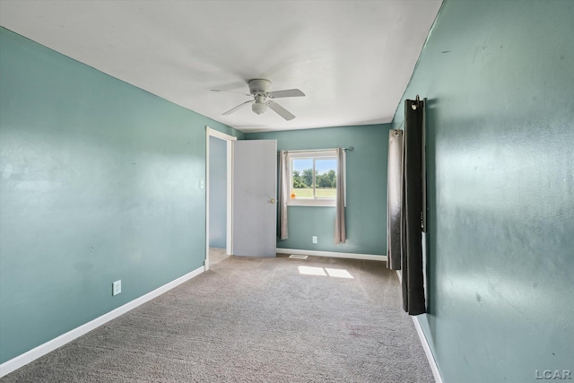 14211 Gilbert Rd, Waldron, MI 49288 - carpeted spare room featuring a ceiling fan and baseboards
