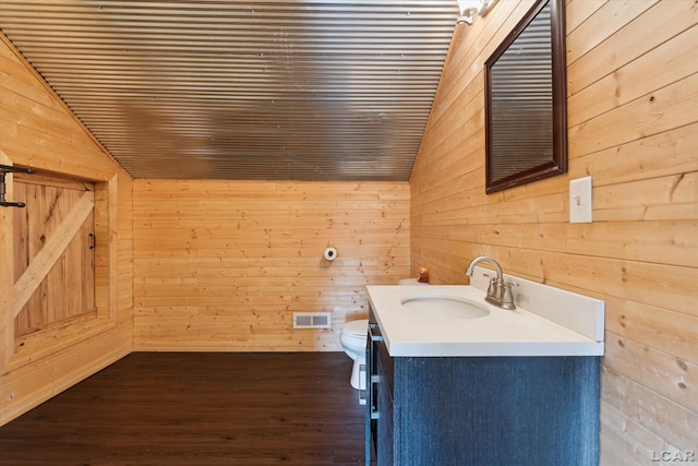 14211 Gilbert Rd, Waldron, MI 49288 - bathroom with vaulted ceiling, wood walls, vanity, wood finished floors, and wood ceiling