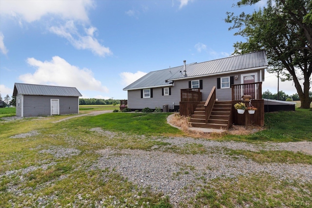 14211 Gilbert Rd, Waldron, MI 49288 - back of house featuring a wooden deck, a metal roof, a yard, and stairway