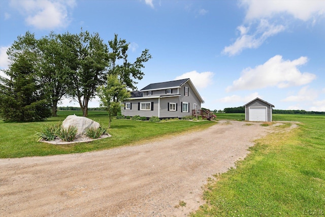 14211 Gilbert Rd, Waldron, MI 49288 - view of front of property with driveway, an outdoor structure, a detached garage, and a front lawn