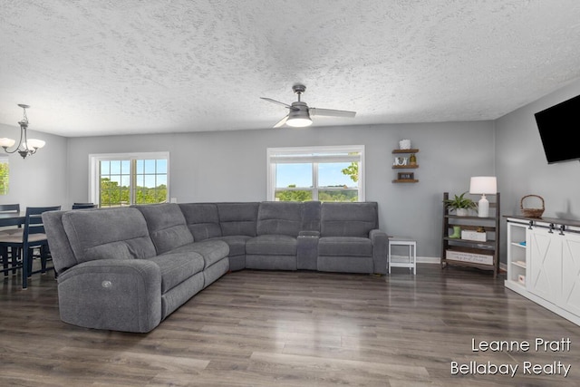 127 Hamilton Ln, Dowling, MI 49050 - living area with healthy amount of natural light, a chandelier, wood finished floors, and a textured ceiling