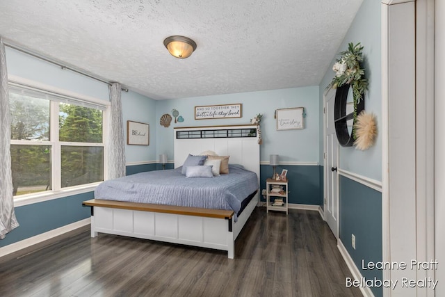 127 Hamilton Ln, Dowling, MI 49050 - bedroom with a textured ceiling and wood finished floors