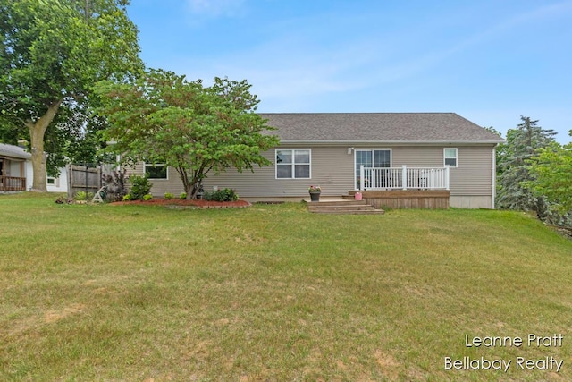 127 Hamilton Ln, Dowling, MI 49050 - view of front of house featuring a front lawn and a deck