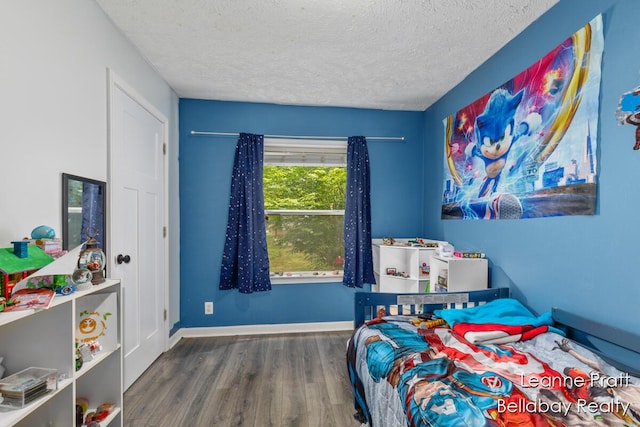 127 Hamilton Ln, Dowling, MI 49050 - bedroom with wood finished floors and a textured ceiling