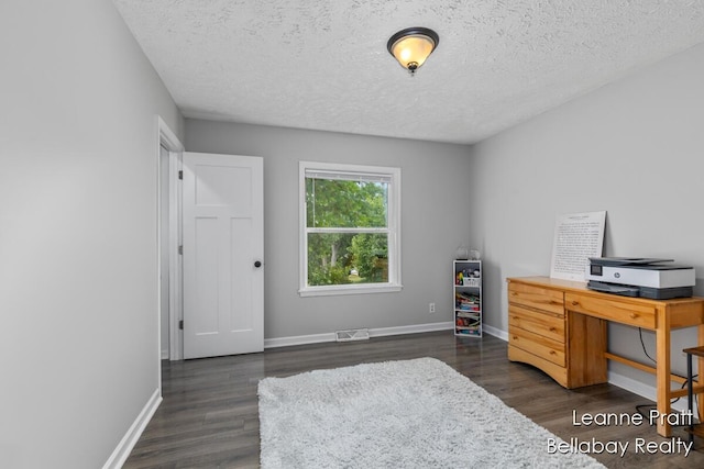 127 Hamilton Ln, Dowling, MI 49050 - office featuring dark wood-style flooring and a textured ceiling