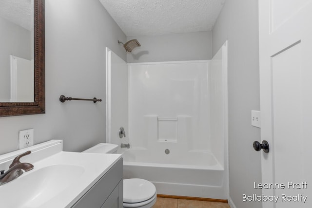 127 Hamilton Ln, Dowling, MI 49050 - bathroom featuring a textured ceiling, vanity, tub / shower combination, and tile patterned floors