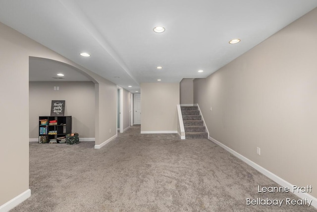 127 Hamilton Ln, Dowling, MI 49050 - finished below grade area featuring carpet floors, recessed lighting, stairway, and arched walkways