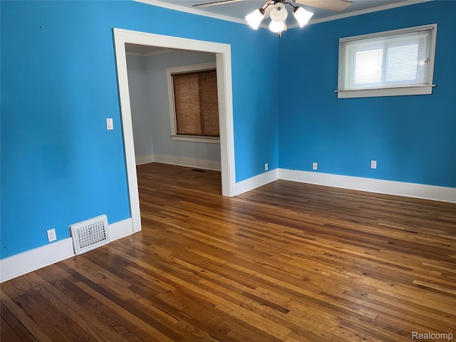 8467 Central St, Center Line, MI 48015 - empty room featuring ornamental molding, a ceiling fan, and hardwood / wood-style floors