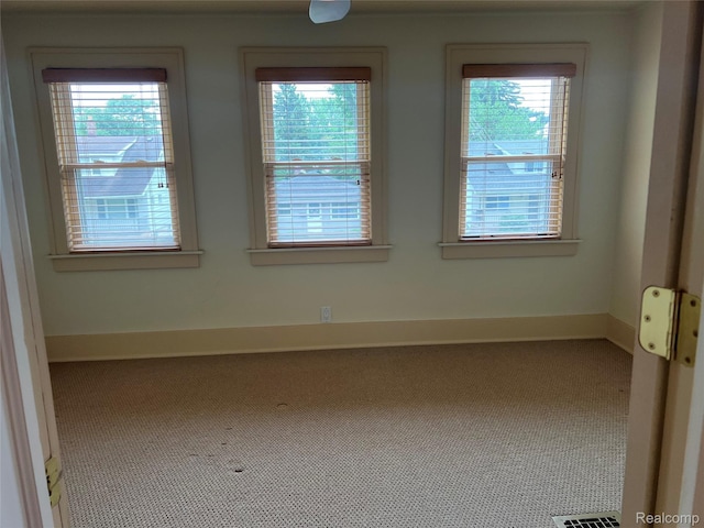 8467 Central St, Center Line, MI 48015 - empty room with healthy amount of natural light and carpet