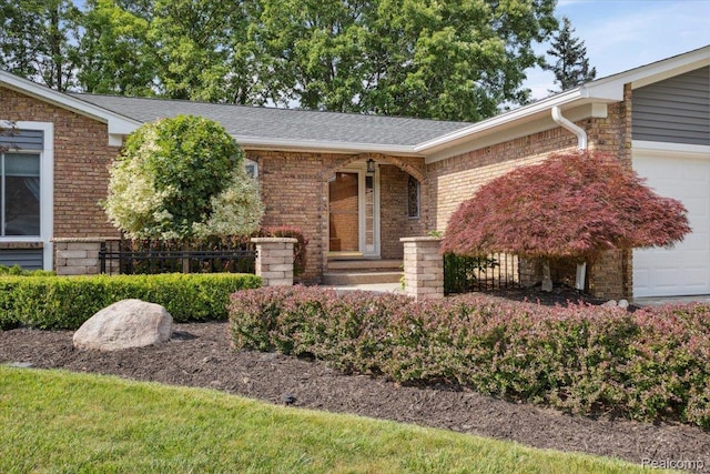 1101 Shallowdale Dr, Troy, MI 48085 - view of front of home featuring an attached garage, brick siding, and a shingled roof