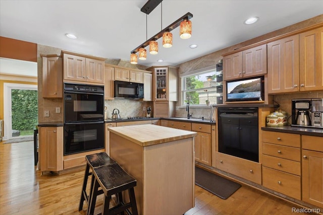 1101 Shallowdale Dr, Troy, MI 48085 - kitchen featuring black appliances, wooden counters, plenty of natural light, decorative backsplash, and recessed lighting