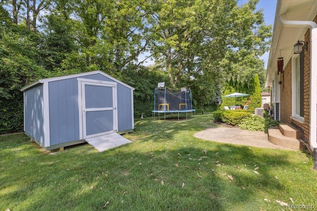 1101 Shallowdale Dr, Troy, MI 48085 - view of grassy yard featuring a trampoline and a shed