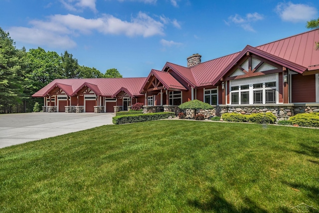 199 E Brooks Rd, Midland, MI 48640 - view of front facade with stone siding, a chimney, a metal roof, a standing seam roof, and a front yard