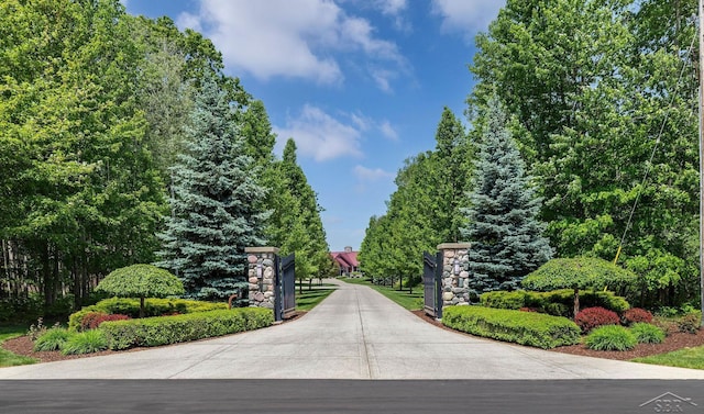 199 E Brooks Rd, Midland, MI 48640 - view of concrete driveway featuring a gated entry