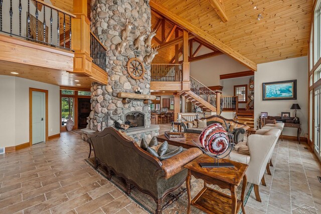 199 E Brooks Rd, Midland, MI 48640 - living room featuring high vaulted ceiling, stairs, a fireplace, and a wood ceiling with exposed beams