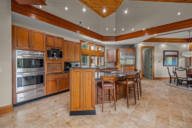 199 E Brooks Rd, Midland, MI 48640 - kitchen with appliances with stainless steel finishes, a warming drawer, brown cabinets, plenty of natural light, and crown molding