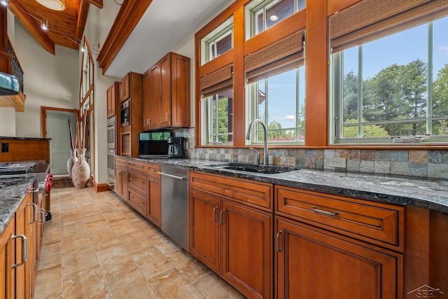 199 E Brooks Rd, Midland, MI 48640 - kitchen with appliances with stainless steel finishes, backsplash, brown cabinetry, and dark stone counters