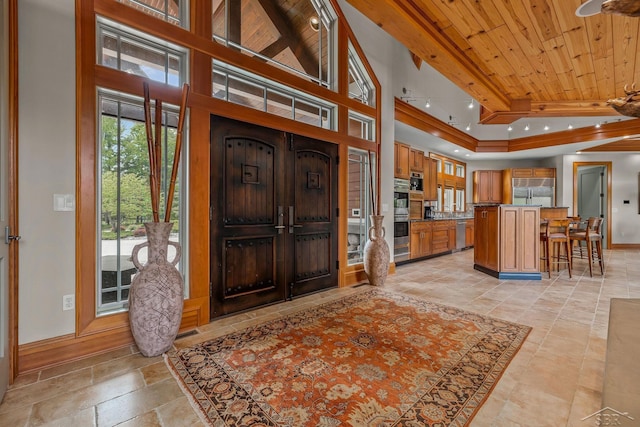 199 E Brooks Rd, Midland, MI 48640 - foyer entrance with wood ceiling, stone tile floors, and a raised ceiling