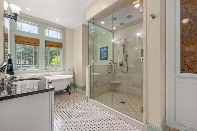 199 E Brooks Rd, Midland, MI 48640 - full bathroom featuring a stall shower, a freestanding tub, recessed lighting, and vanity