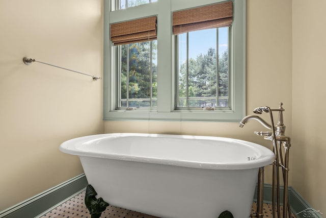 199 E Brooks Rd, Midland, MI 48640 - full bath featuring a freestanding tub and baseboards