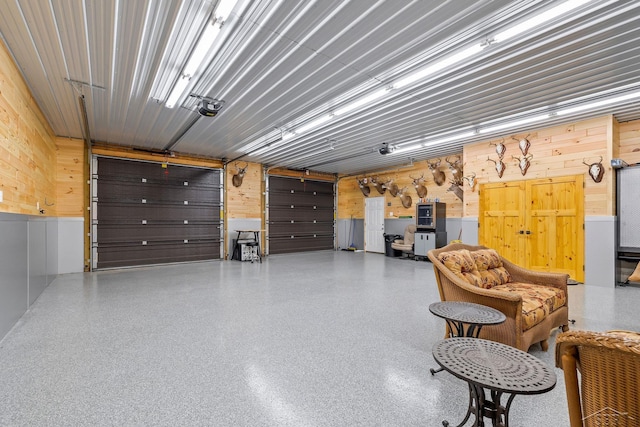 199 E Brooks Rd, Midland, MI 48640 - garage featuring wood walls and a garage door opener
