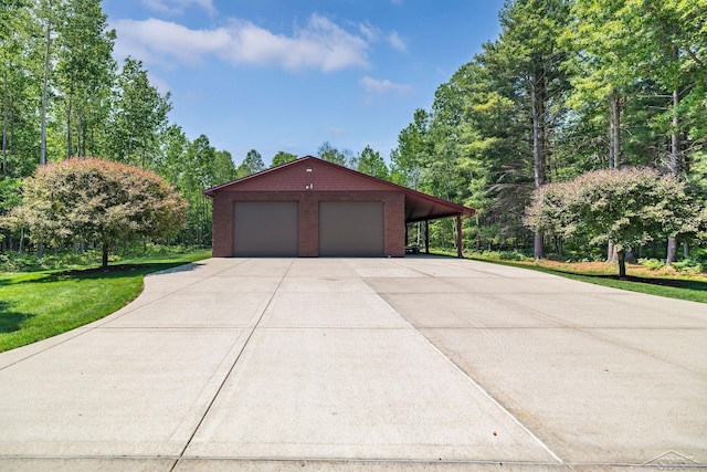 199 E Brooks Rd, Midland, MI 48640 - garage featuring driveway and a garage