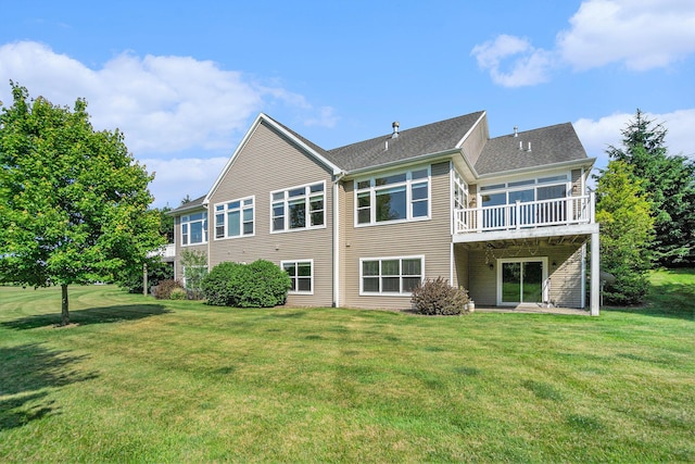 8842 Oakland Hills Cir, Portage, MI 49024 - rear view of property with a yard, a wooden deck, a sunroom, and roof with shingles