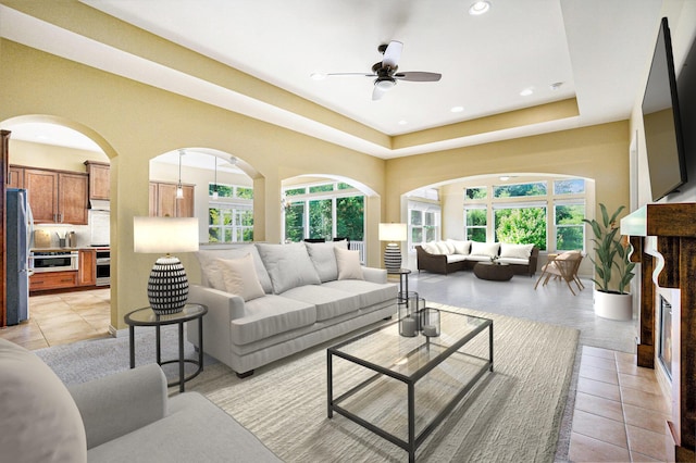8842 Oakland Hills Cir, Portage, MI 49024 - living area featuring a ceiling fan, recessed lighting, light tile patterned flooring, and arched walkways